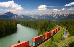 Freight train moving along Bow river in Canadian Rockies, Banff National Park, Alberta, Canada